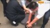 香港记者北京采访时被拘 香港民主党谴责